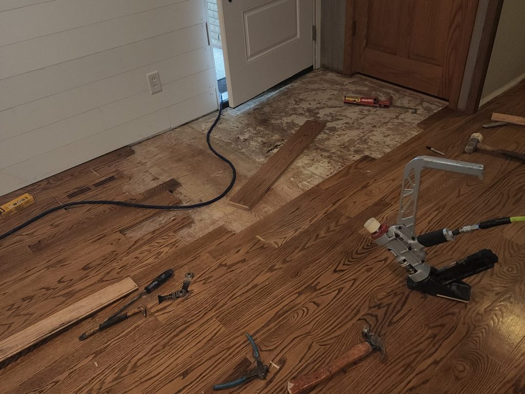 A floor being refinished with wood flooring