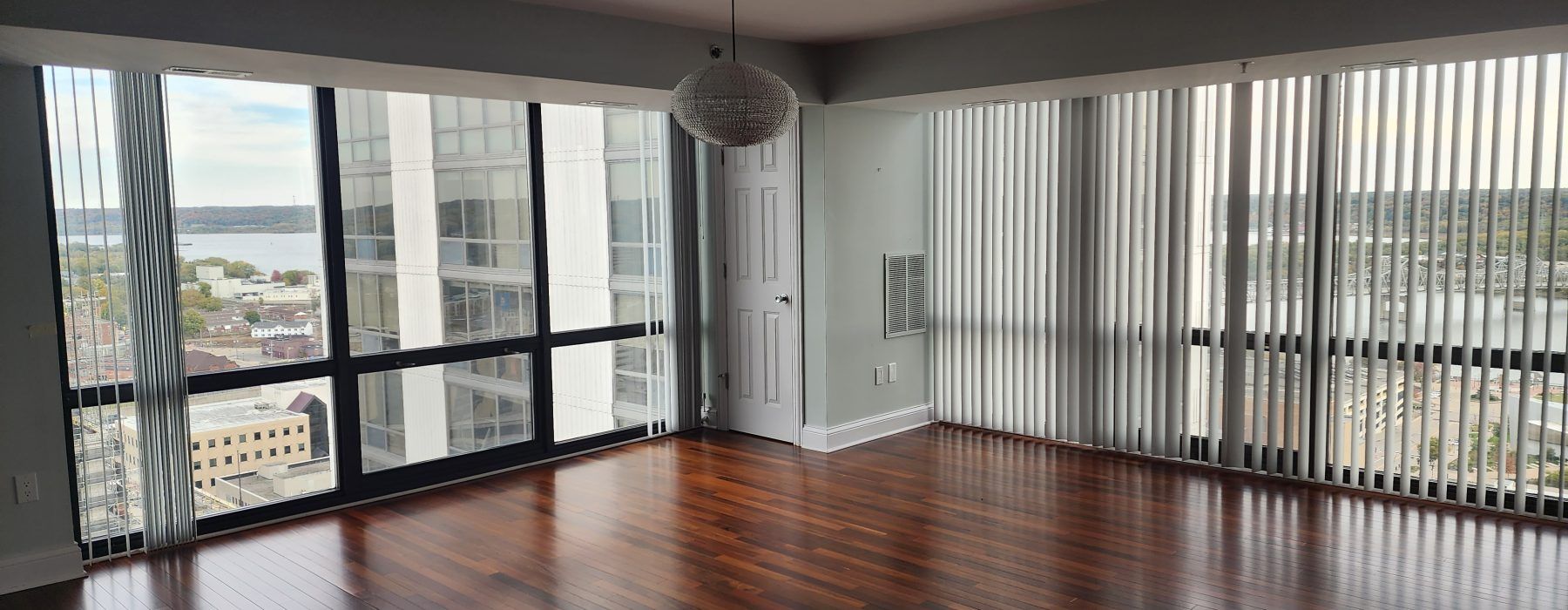 A room with hardwood floors and white walls.