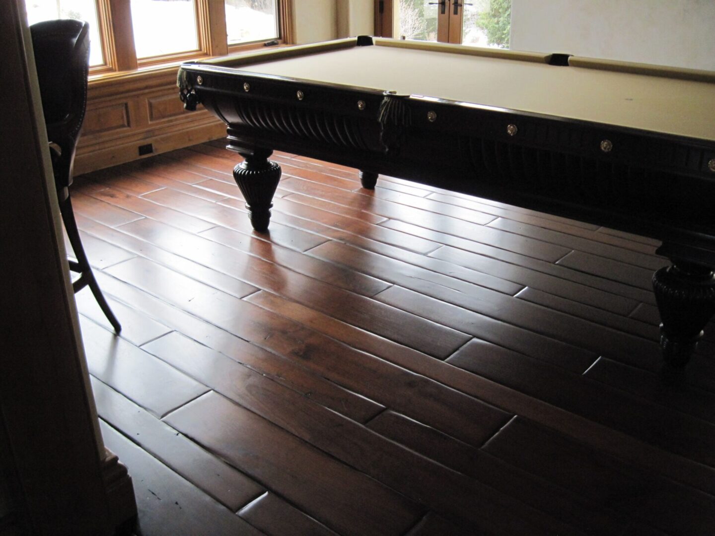 A pool table in the middle of a room.